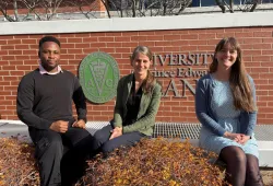 Tunmise Faith Ehigbor, Dr. Caroline Ritter, and  Dr. Katie Koralesky seated outdoors