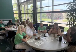 groups of people sitting around tables