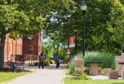 photo of people walking on campus during summer
