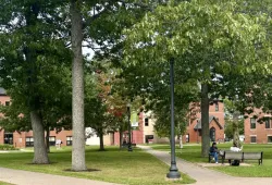 Photo of campus quadrangle in September with Steel Building in the background