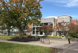 photo of modern campus building during fall