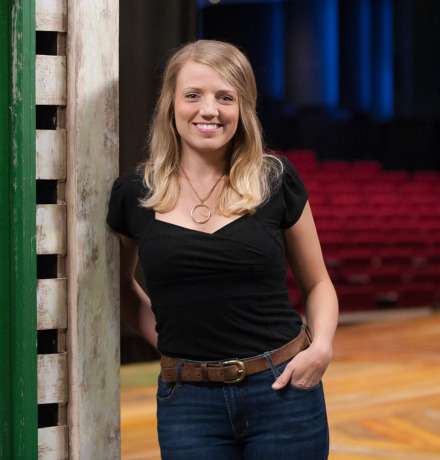Brittany stands on stage