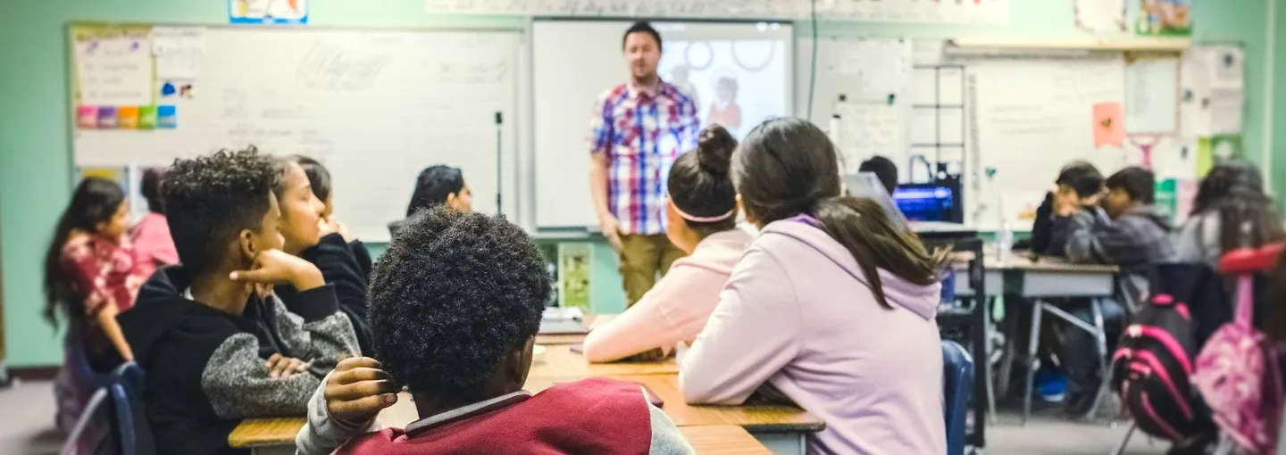 an elementary school classroom with a teacher and students