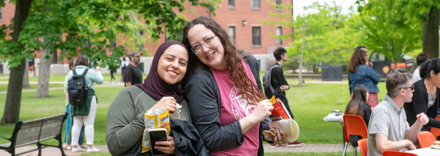 two people smiling in the UPEI quad