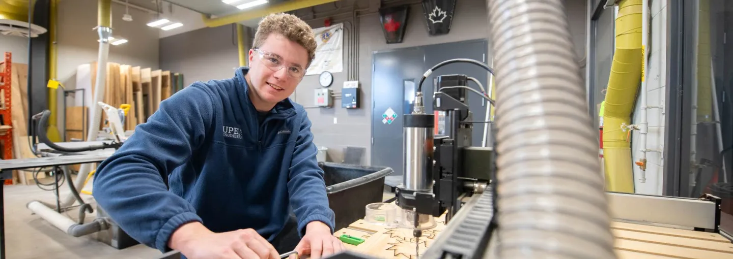 a student wearing safety glasses working in a laboratory
