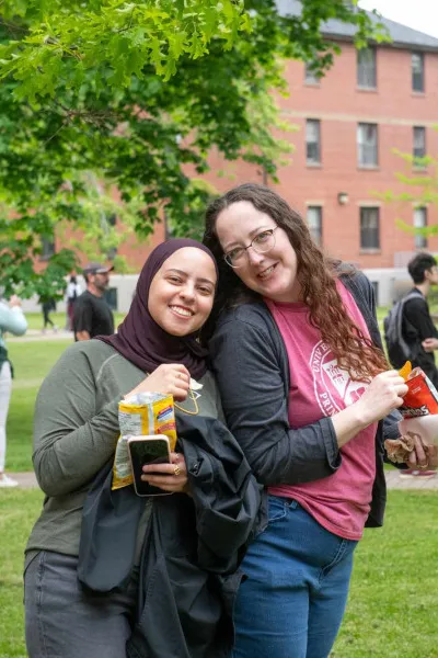 two people smiling in the UPEI quad
