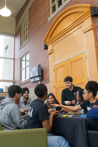 a group of students playing a board game