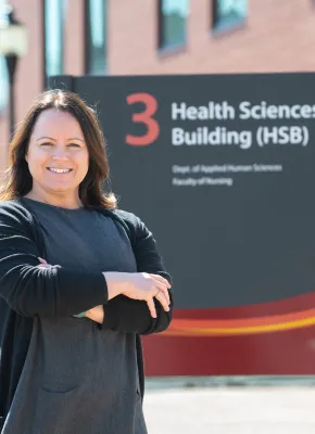 UPEI grad student and instructor Bethany Vessey by the Health Sciences Building