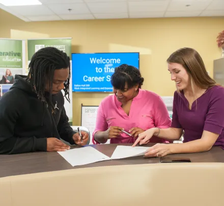 three students at the UPEI career studio