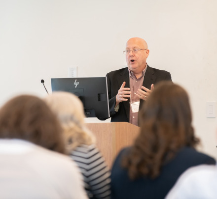 a faculty member at a podium