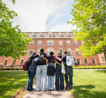 a group of students in front of SDU Main Building