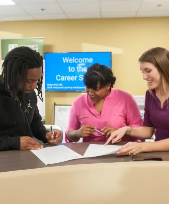 three students at the UPEI career studio