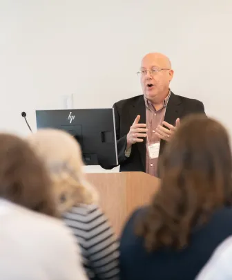 a faculty member at a podium