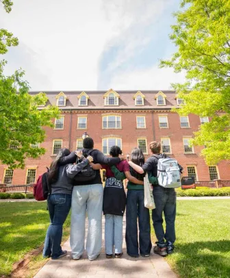 a group of students in front of SDU Main Building