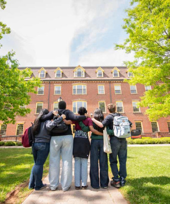 a group of students in front of SDU Main Building