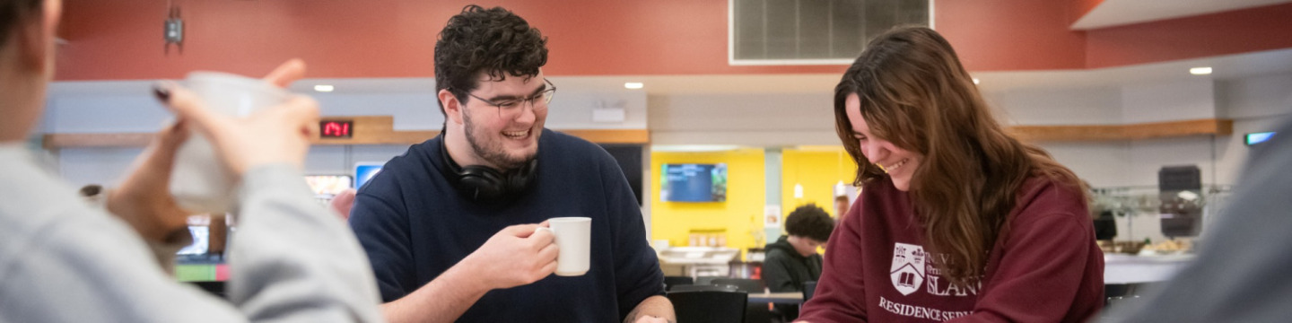 two students dining in the Wanda Wyatt Dining Hall at UPEI