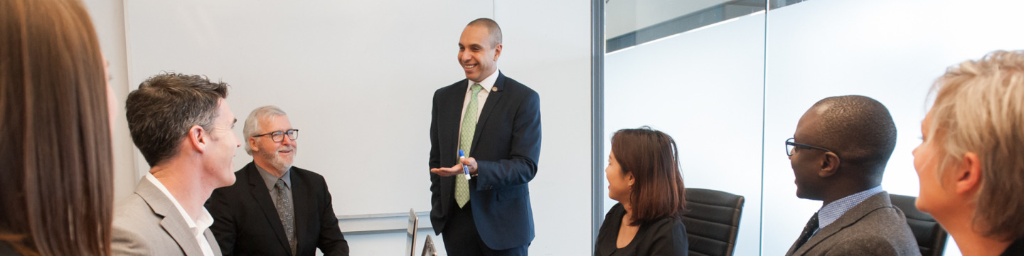 An EMBA professor lectures to students