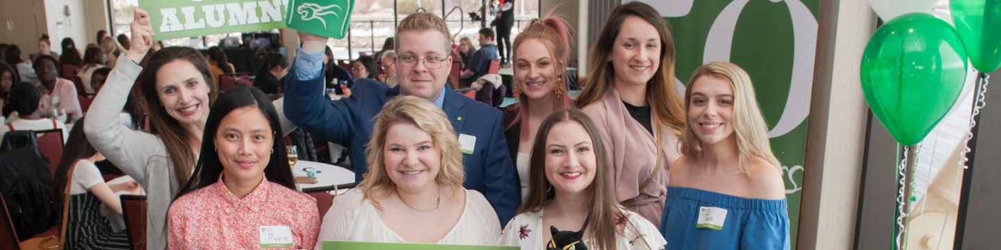 eight upei students posing for an alumni event photo
