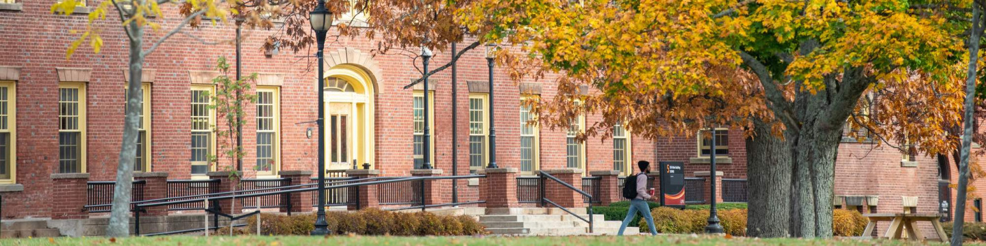 SDU Main Building in fall surrounded by coloured leaves