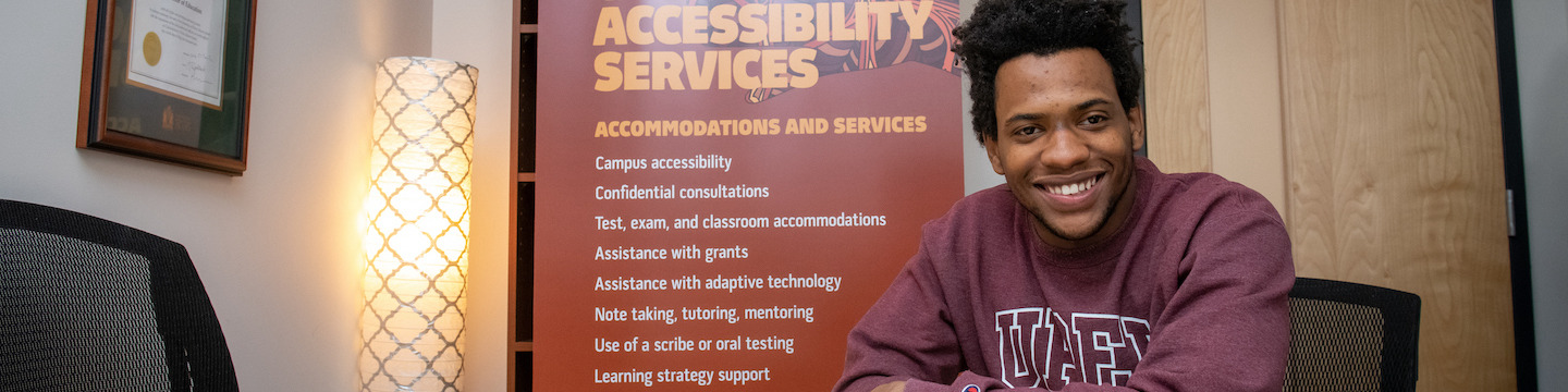 UPEI student Antwaun Rolle seated at boardroom table 