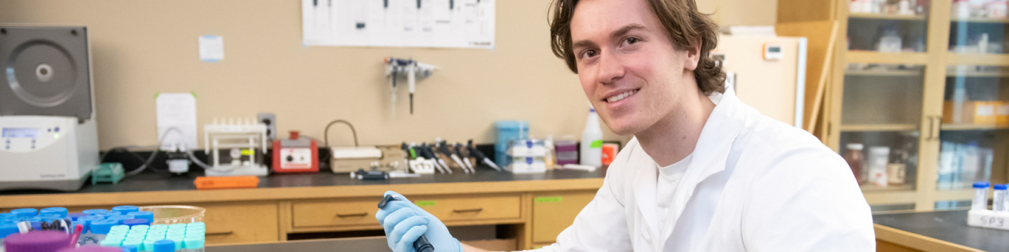 upei graduate student olivier philips working at a table