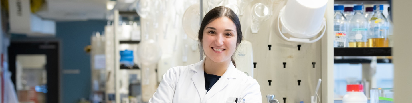 upei chemistry graduate maggie leclair standing in a laboratory
