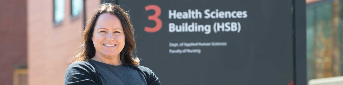 UPEI grad student and instructor Bethany Vessey by the Health Sciences Building