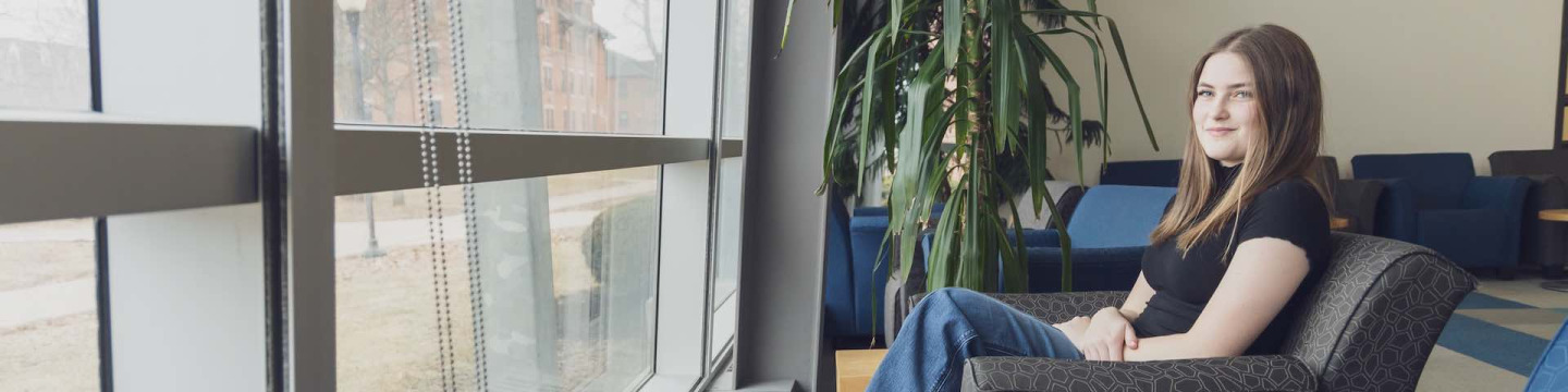UPEI sociology graduate Andraya Gallant in the AVC Learning Commons