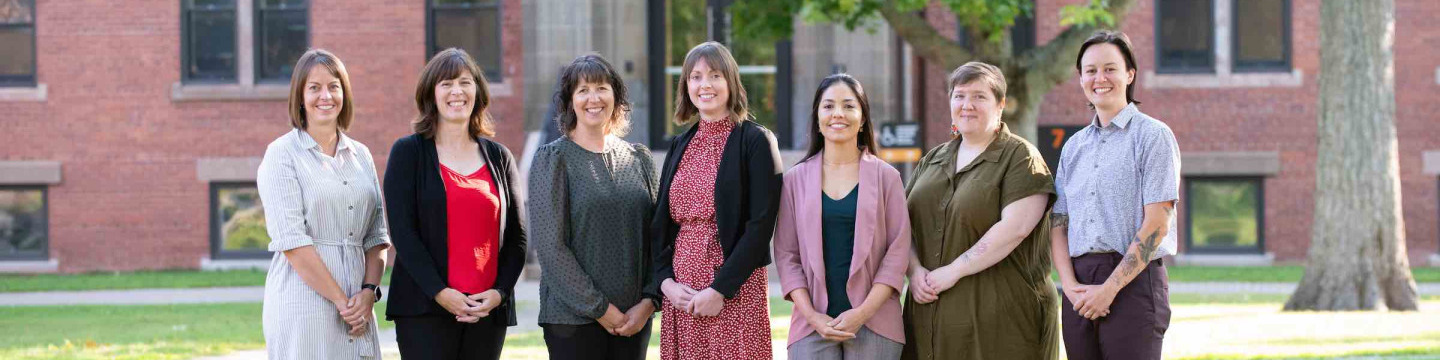 seven staff members of UPEI's Experiential Education department, by Dalton Hall