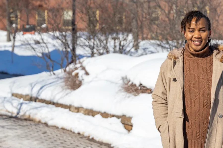 UPEI graduate Patience Adaobor standing in the quad in winter