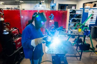 upei engineering student bridget patterson using welding equipment