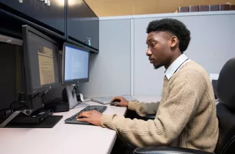 UPEI student Joshua Symonette working at a computer
