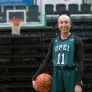 UPEI student and basketball guard Lauren Rainford holding a basketball