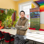 MAIS student Hexi Wang working in a student lounge
