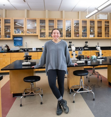 a UPEI biology student in a laboratory