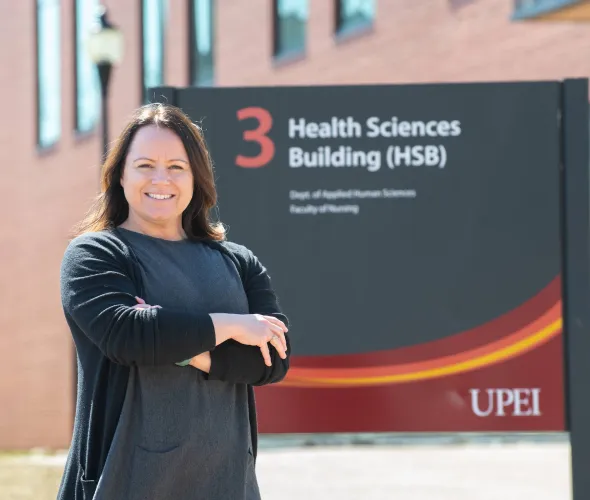 UPEI grad student and instructor Bethany Vessey by the Health Sciences Building