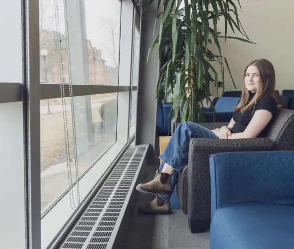 UPEI sociology graduate Andraya Gallant in the AVC Learning Commons